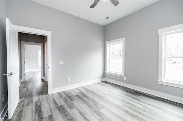 11AC Glass Rd, Hayes, VA 23072 - empty room with visible vents, ceiling fan, baseboards, and wood finished floors