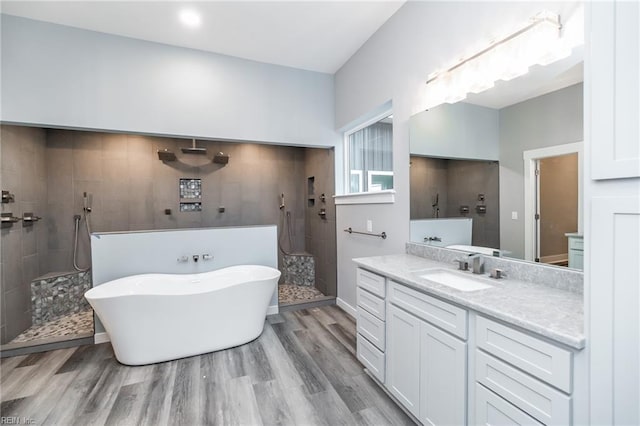 11AC Glass Rd, Hayes, VA 23072 - bathroom featuring vanity, a soaking tub, wood finished floors, and walk in shower