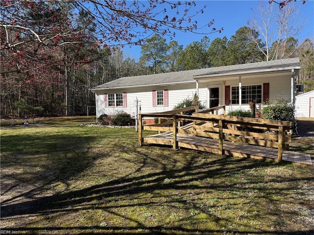 view of front of property with a porch and a front lawn