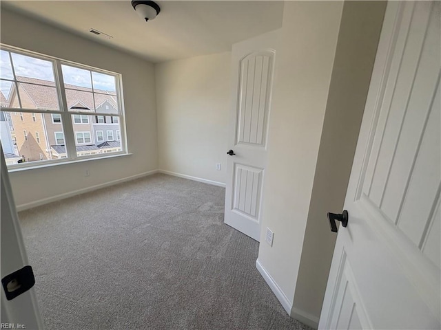 2014 Stanford Ln, Newport News, VA 23608 - spare room featuring carpet flooring and baseboards
