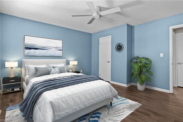 bedroom with baseboards, wood finished floors, ceiling fan, and a textured ceiling