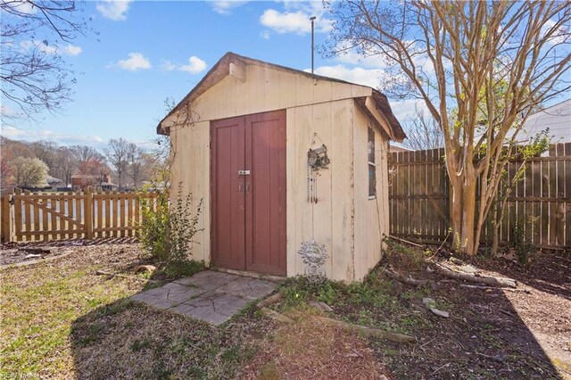 view of shed with a fenced backyard