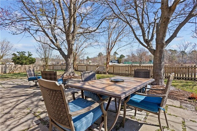 view of patio with a fenced backyard and outdoor dining area