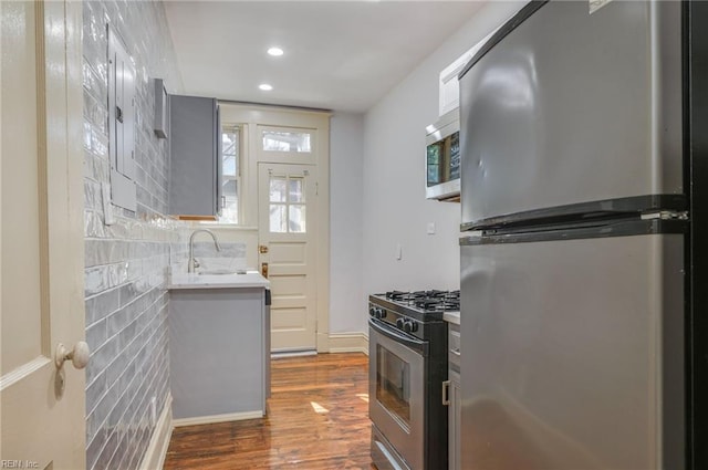 911 Spotswood Ave Unit 6, Norfolk, VA 23517 - kitchen featuring appliances with stainless steel finishes, a sink, dark wood-type flooring, recessed lighting, and light countertops