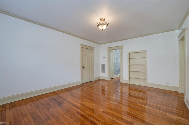 911 Spotswood Ave Unit 4, Norfolk, VA 23517 - empty room with built in shelves, crown molding, baseboards, and wood-type flooring