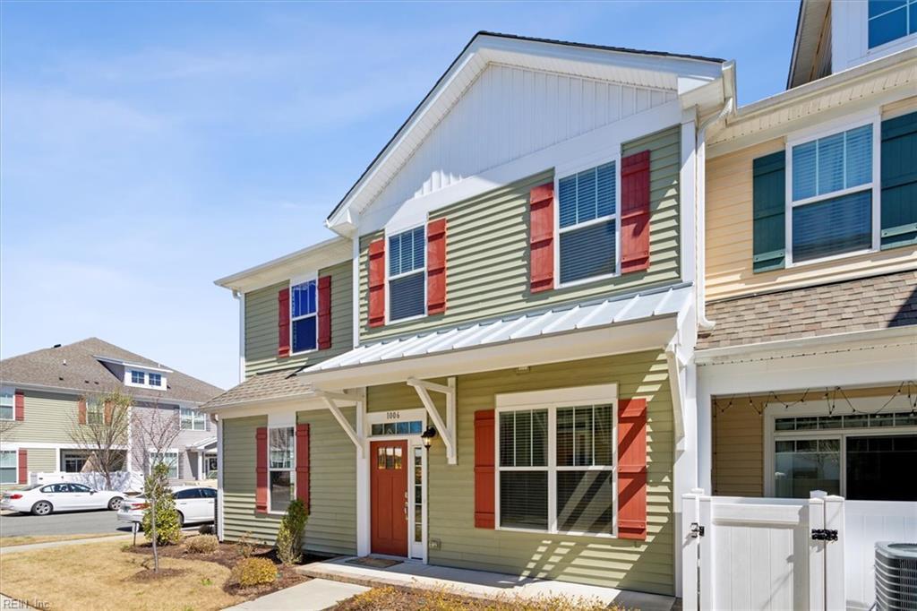 1006 Celia Ct, Hampton, VA 23666 - view of front of house with central AC unit, fence, and roof with shingles