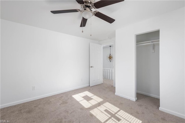 unfurnished bedroom with baseboards, carpet floors, a closet, and a ceiling fan