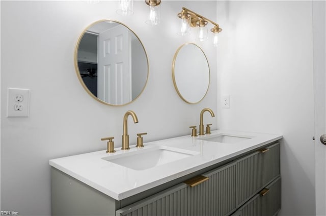 bathroom featuring double vanity and a sink