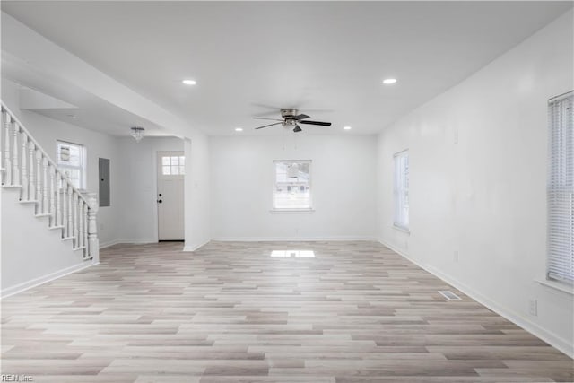 interior space with ceiling fan, baseboards, stairs, and recessed lighting