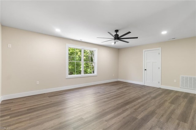 unfurnished room featuring ceiling fan, recessed lighting, baseboards, wood finished floors, and visible vents