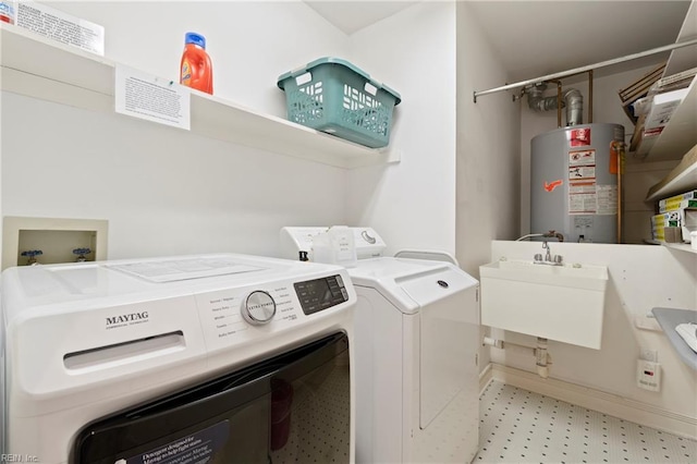 832 Surfside Ave, Virginia Beach, VA 23451 - washroom with washing machine and clothes dryer, gas water heater, laundry area, light floors, and a sink