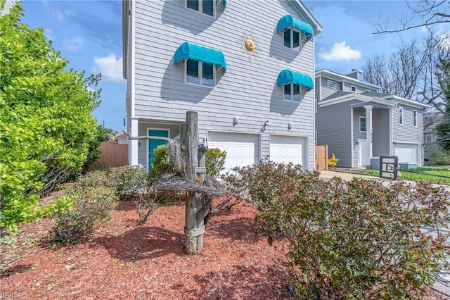 832 Surfside Ave, Virginia Beach, VA 23451 - view of front facade with a garage