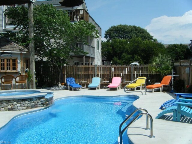 832 Surfside Ave, Virginia Beach, VA 23451 - view of pool with a community hot tub, fence, a fenced in pool, and a patio