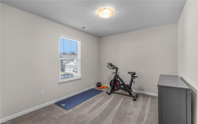 workout area featuring carpet flooring, baseboards, and visible vents