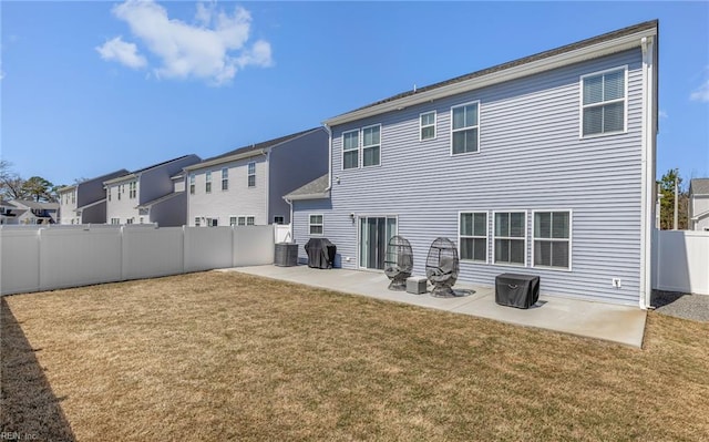 rear view of property featuring a patio, central air condition unit, a lawn, and a fenced backyard