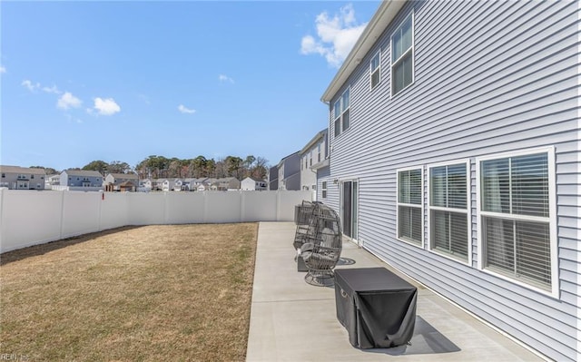 view of yard with a fenced backyard and a patio area