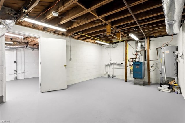unfinished below grade area with a heating unit and gas water heater