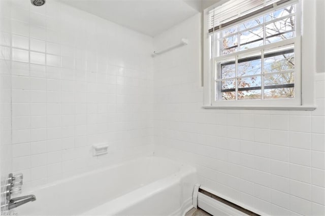 bathroom featuring a baseboard radiator, tile walls, and shower / bath combination