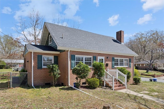 view of front of property with fence, crawl space, a front lawn, brick siding, and a chimney