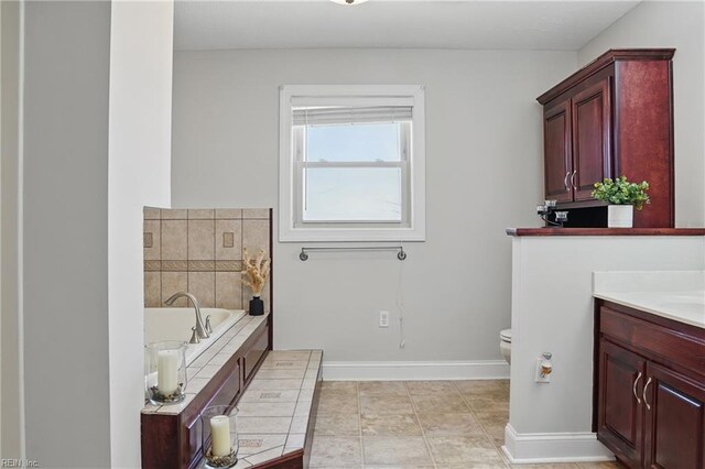 421 Richneck Rd, Newport News, VA 23608 - full bath featuring tile patterned floors, toilet, vanity, a bath, and baseboards