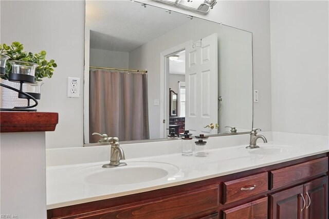 421 Richneck Rd, Newport News, VA 23608 - bathroom featuring double vanity and a sink
