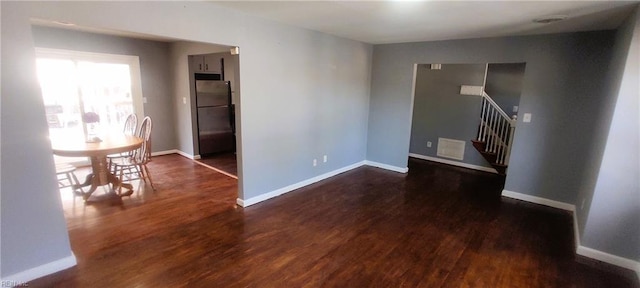 1116 Faubus Dr, Newport News, VA 23605 - unfurnished room with baseboards, stairs, and wood finished floors