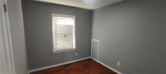 1116 Faubus Dr, Newport News, VA 23605 - unfurnished room featuring baseboards, dark wood-style floors, and visible vents