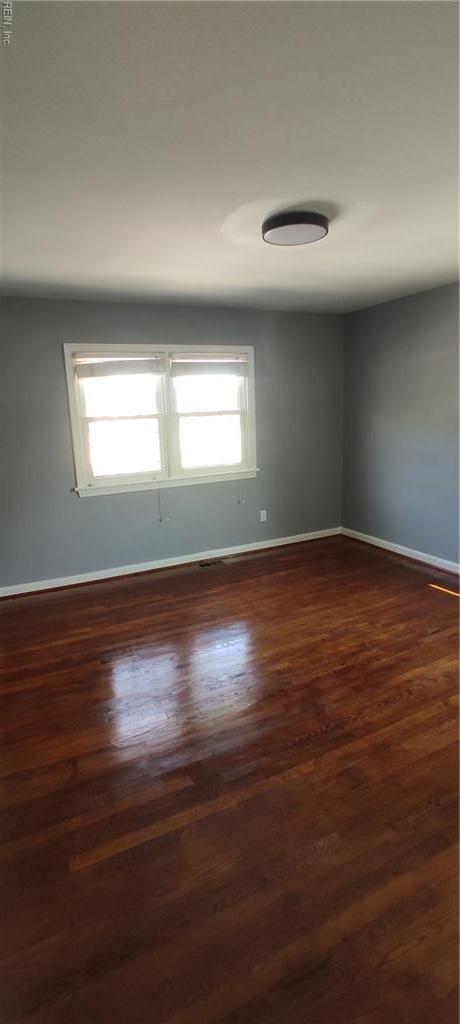 1116 Faubus Dr, Newport News, VA 23605 - empty room featuring baseboards, a healthy amount of sunlight, and dark wood finished floors