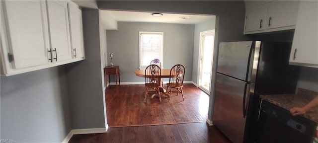 1116 Faubus Dr, Newport News, VA 23605 - kitchen with freestanding refrigerator, white cabinets, dark wood-type flooring, and baseboards