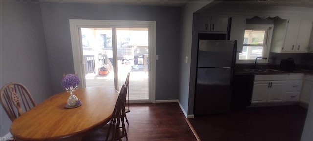 1116 Faubus Dr, Newport News, VA 23605 - dining area with baseboards and dark wood-type flooring