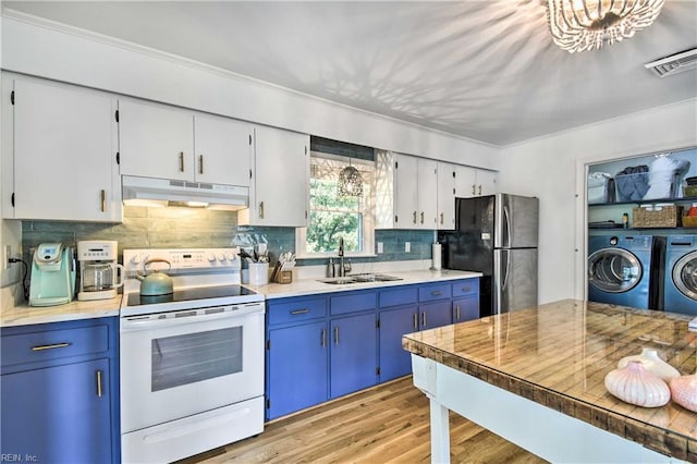 38 Callis Ln, Deltaville, VA 23043 - kitchen featuring a sink, freestanding refrigerator, white electric stove, under cabinet range hood, and independent washer and dryer