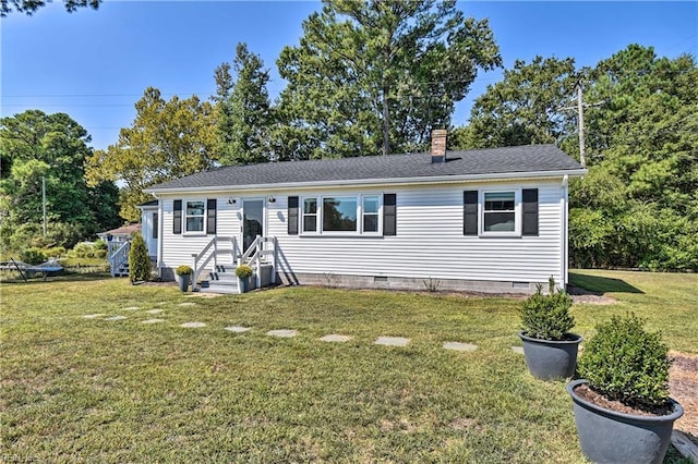 38 Callis Ln, Deltaville, VA 23043 - view of front facade with a chimney, a front lawn, crawl space, and roof with shingles