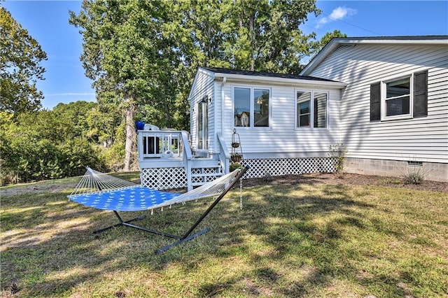 38 Callis Ln, Deltaville, VA 23043 - exterior space featuring crawl space, a wooden deck, and a yard