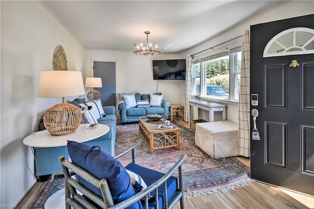38 Callis Ln, Deltaville, VA 23043 - living area with wood finished floors, a chandelier, and crown molding