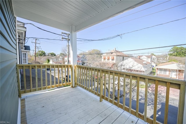 wooden terrace with a residential view