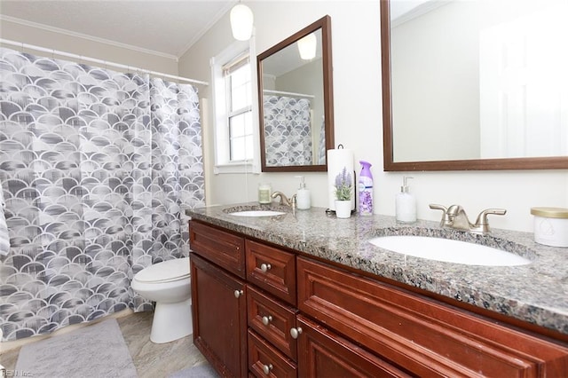 full bathroom with toilet, double vanity, a sink, and crown molding