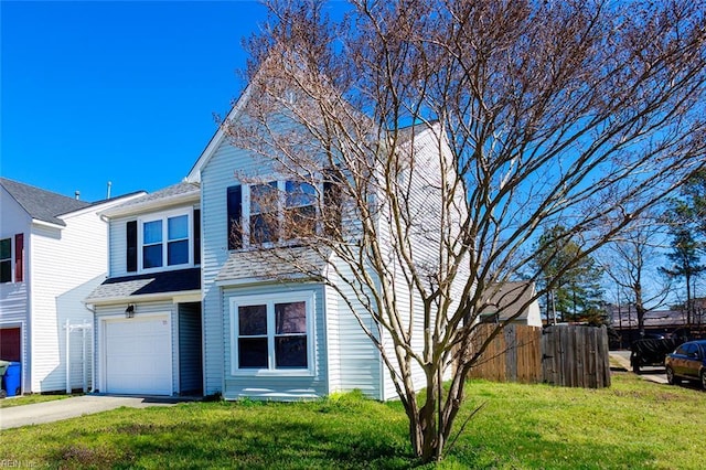traditional home featuring driveway, a front yard, fence, a shingled roof, and a garage
