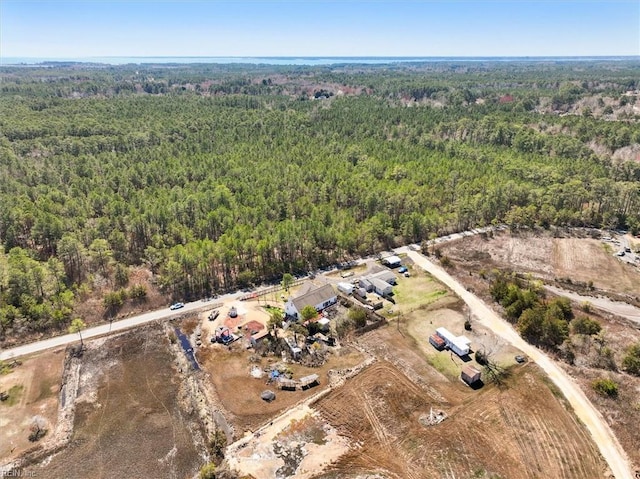 drone / aerial view featuring a view of trees