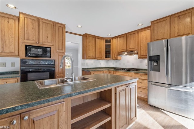 127 Freemoor Dr, Poquoson, VA 23662 - kitchen featuring under cabinet range hood, a sink, dark countertops, black appliances, and brown cabinets