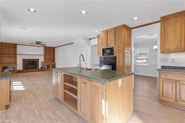 127 Freemoor Dr, Poquoson, VA 23662 - kitchen featuring a sink, dark countertops, a ceiling fan, black appliances, and a fireplace