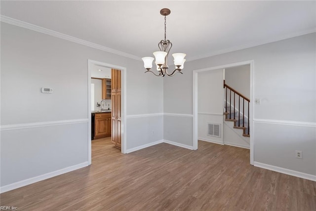 127 Freemoor Dr, Poquoson, VA 23662 - empty room featuring baseboards, visible vents, light wood-style floors, and a chandelier