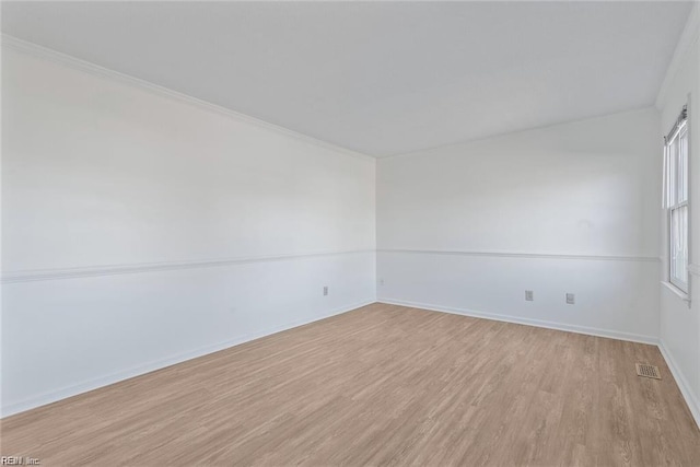 127 Freemoor Dr, Poquoson, VA 23662 - unfurnished room with light wood finished floors, baseboards, visible vents, and ornamental molding