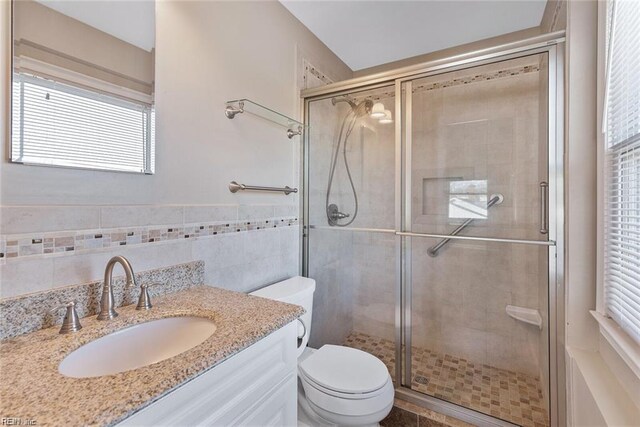 127 Freemoor Dr, Poquoson, VA 23662 - full bath with tile walls, toilet, a stall shower, and vanity