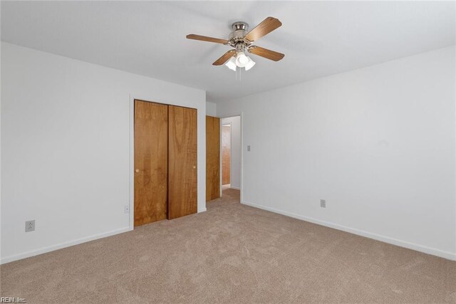 127 Freemoor Dr, Poquoson, VA 23662 - unfurnished bedroom with baseboards, a closet, carpet floors, and a ceiling fan