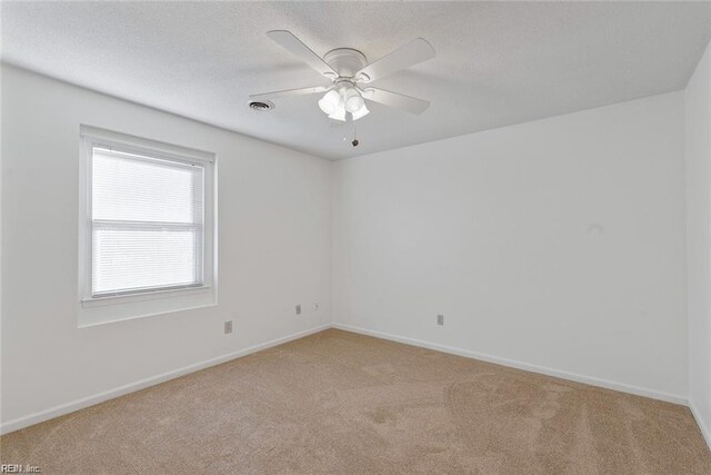 127 Freemoor Dr, Poquoson, VA 23662 - spare room featuring a ceiling fan, baseboards, light colored carpet, and a textured ceiling