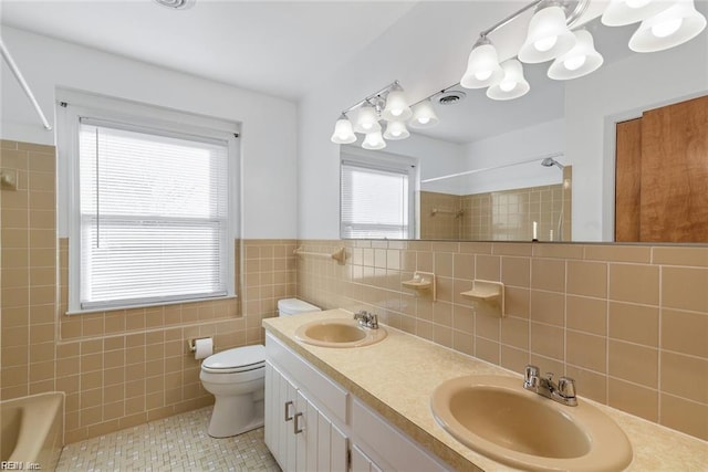 127 Freemoor Dr, Poquoson, VA 23662 - full bath featuring tile walls, a sink, and a healthy amount of sunlight