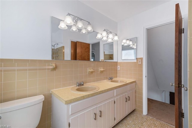 127 Freemoor Dr, Poquoson, VA 23662 - full bath with tile walls, toilet, double vanity, and a sink