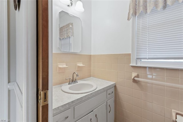 127 Freemoor Dr, Poquoson, VA 23662 - bathroom featuring tile walls, wainscoting, and vanity