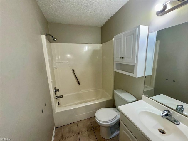 full bath featuring tub / shower combination, a textured ceiling, toilet, tile patterned floors, and vanity