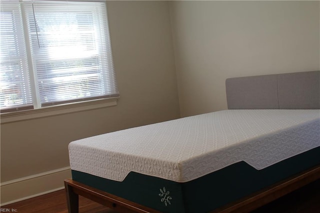 bedroom with wood finished floors